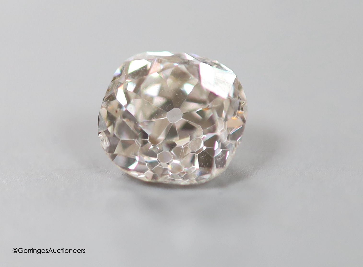 An unmounted cushion cut diamond, weighing approximately 1.10ct